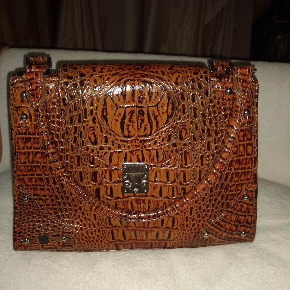 Diva Collection mock croc embossed bag.